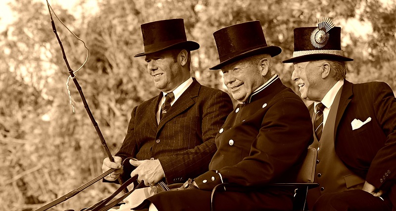 3 coachmen wearing top hats