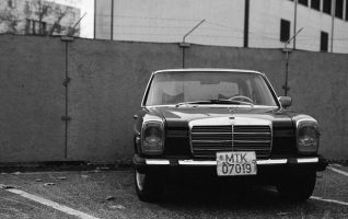old car parked in a parking lot