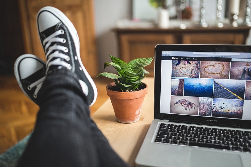 person with their feet up on a desk