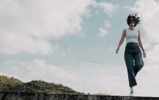 woman standing on one leg