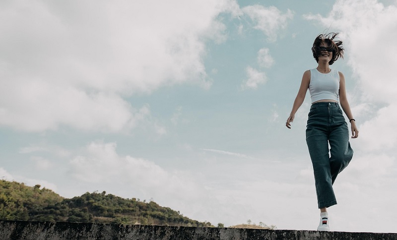 woman standing on one leg