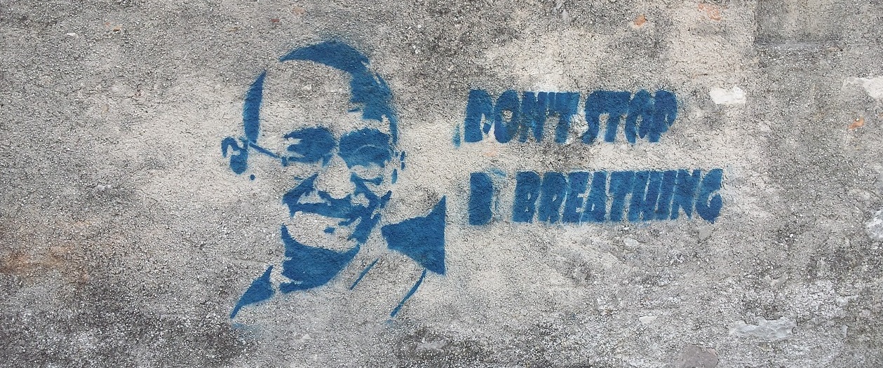 graffiti that says "don't stop breathing"