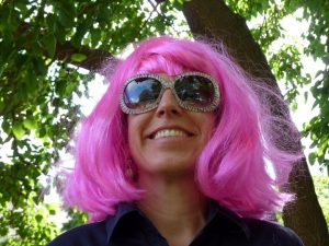 the author wearing her favorite pink wig