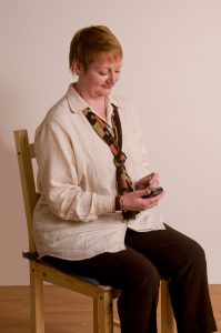 woman texting with good posture