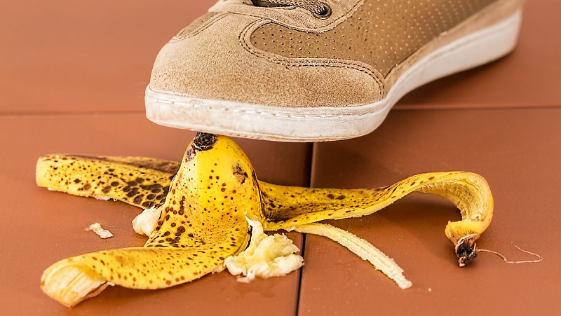 person stepping on a banana peel