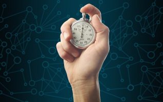 hand holding a stopwatch