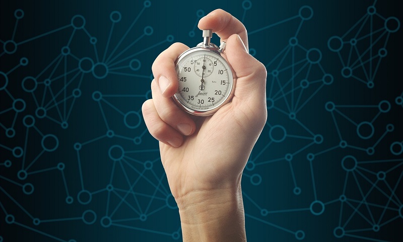 hand holding a stopwatch