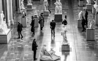 museum gallery with tourists